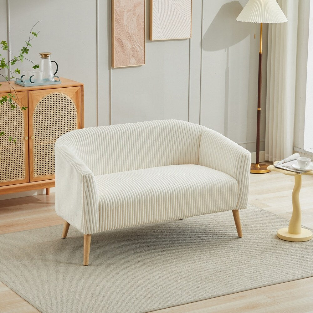 Canapé 2 places recouvert de tissu velours côtelé avec pieds en noyer